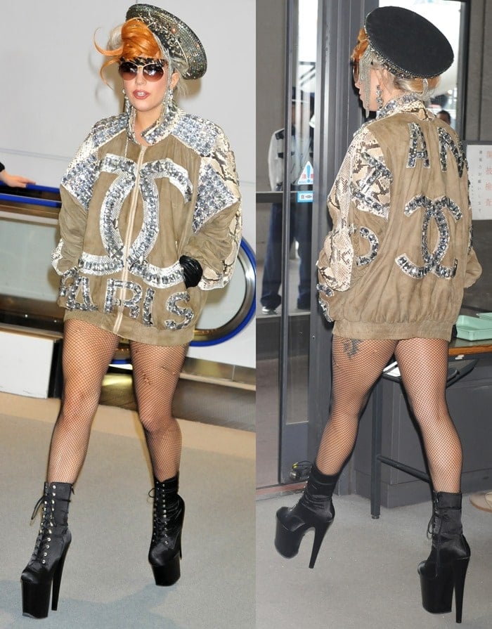 Lady Gaga pairs towering black lace-up platform ankle boots with fishnet tights and an oversized embellished jacket