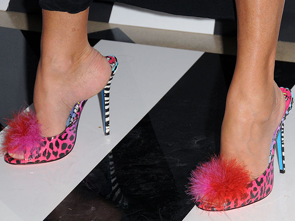 Lady Lillian Cavendish's feet look delightful in Jimmy Choo 'Tickle' heels from the Rob Pruitt collection, featuring bold pink leopard print and playful feather accents that make a fun, fashion-forward statement