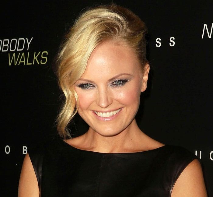 Malin Åkerman sweeps her hair to the side for the premiere of "Nobody Walks"