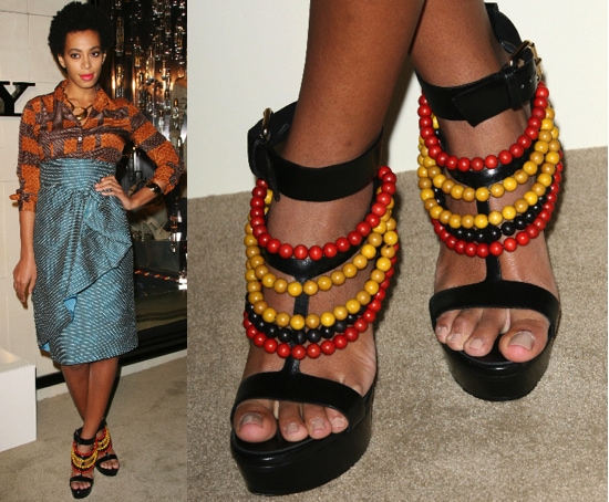 Solange in Burberry Main Solange Knowles attended the Burberry Body fragrance launch in Los Angeles on October 26, 2011, wearing a mix-print ensemble anchored by striking black suede sandals adorned with layered red and yellow wooden beads that perfectly reflected her eclectic, art-inspired style