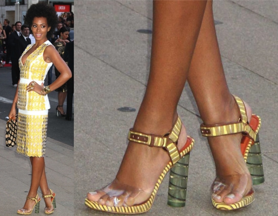 Solange in Lucite Heels Solange Knowles turned heads at the 2012 CFDA Fashion Awards in New York City, wearing a white-and-yellow Marni Spring 2012 paillette dress paired with a patterned Marni clutch and knit Missoni sandals featuring clear straps and sculptural cylindrical heels