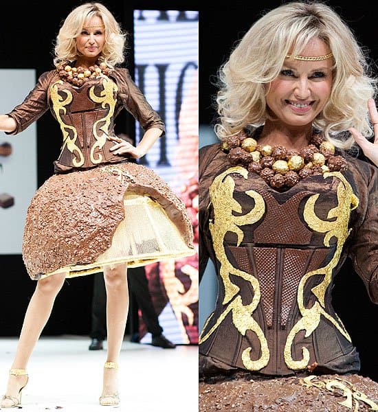 The Chocolate Dress Fashion Show Adriana Karembeu models a stunning ensemble featuring a crispy chocolate ball skirt paired with a delicate chocolate wafer bodice, accentuated by a matching necklace.