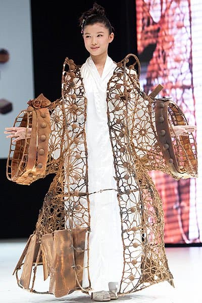The Chocolate Dress Fashion Show Kim Yoo-Jung gracefully models a dress inspired by the traditional Korean hanbok, reimagined in chocolate wire for a delicate, ethereal effect