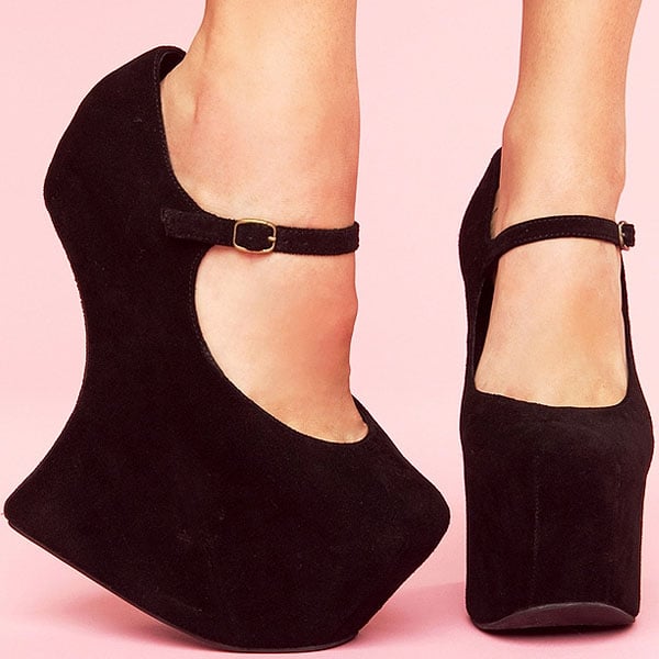 Jeffrey Campbell Night Walk A dainty Mary-Jane strap details a dark suede pump set upon a stunning sculpted wedge heel