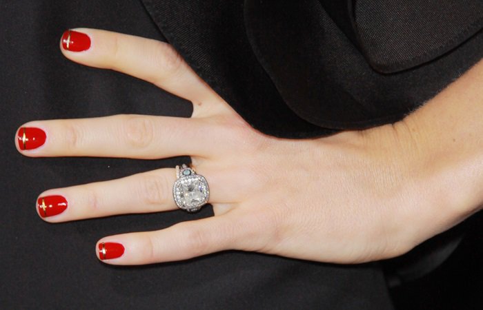 Jessica Biel proudly displays her engagement ring from Brilliance, which features a large center diamond symbolizing her love and commitment