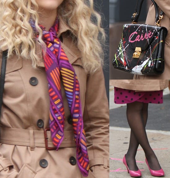 AnnaSophia Robb accessorized with a paint splattered purse in black, pink pumps, a multi-toned beanie, and a gorgeous printed pink silk scarf AnnaSophia Robb elevates her look with vibrant pink pumps and a colorful printed silk scarf, perfectly channeling Carrie Bradshaw’s playful, accessorized aesthetic