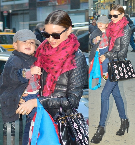 miranda kerr flynn new york nov 26 Miranda Kerr nails the biker-chic look in a quilted leather jacket, skinny jeans, and edgy ankle boots while accessorizing with a bold red scarf and a floral Prada tote, carrying her adorable son Flynn in New York City