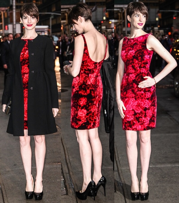 Anne Hathaway steps out in New York City wearing a red floral cocktail dress by Mafalda, styled with a black coat and sleek black platform pumps for a polished, modern evening look