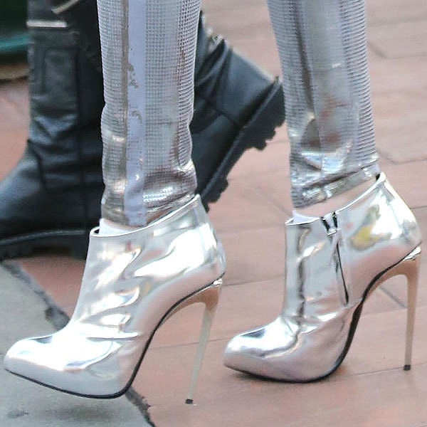Bella Thorne in silver boots Bella Thorne's metallic Giuseppe Zanotti booties perfectly complement her shiny silver jeans