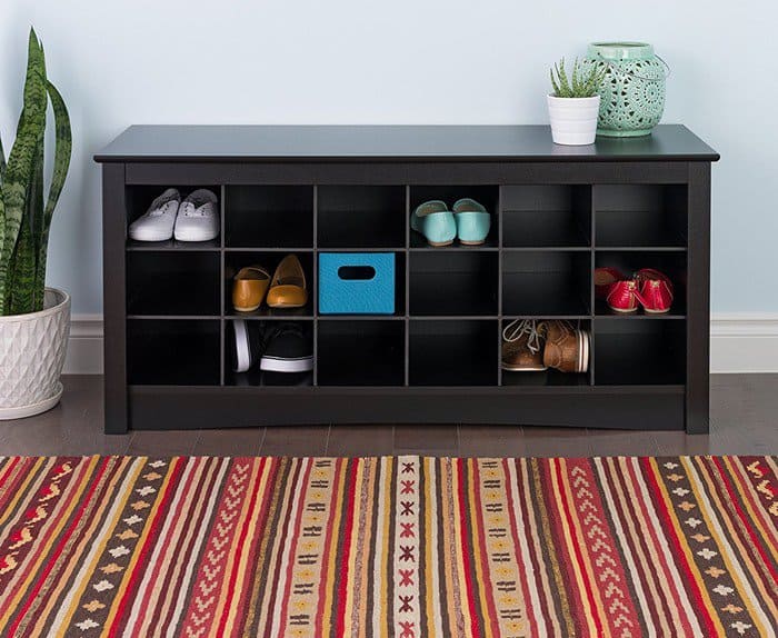 A sleek cubbie bench doubles as both seating and shoe storage, neatly organizing everyday pairs into individual compartments while keeping entryways clean, functional, and visually streamlined