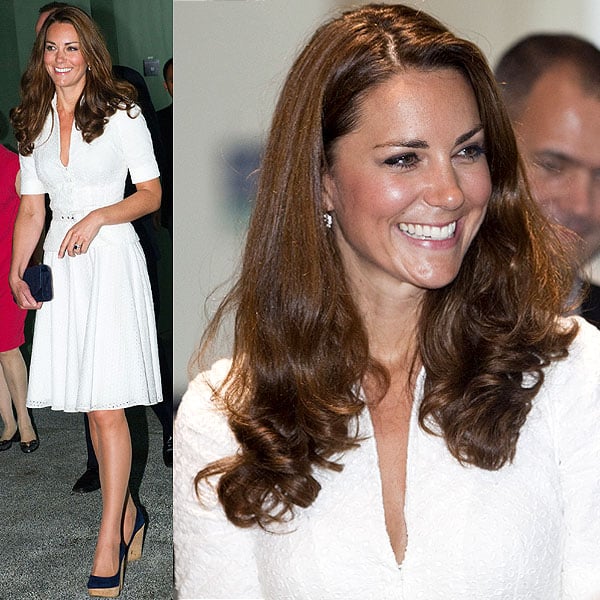 Kate Middleton Gardens By The Bay complex Singapore Kate Middleton looks radiant in a white eyelet belted Alexander McQueen dress, paired with navy blue platform heels and a matching clutch
