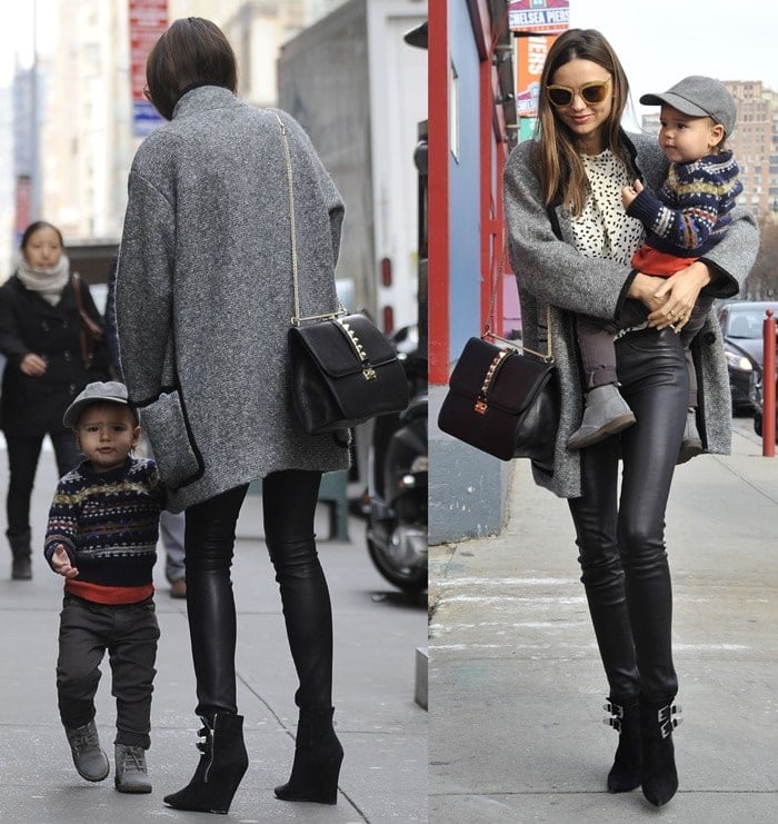 Miranda Kerr nails effortless city chic by pairing an oversized tweed coat with leather leggings, buckle-detailed ankle boots, a studded Valentino bag, and gold Miu Miu sunglasses