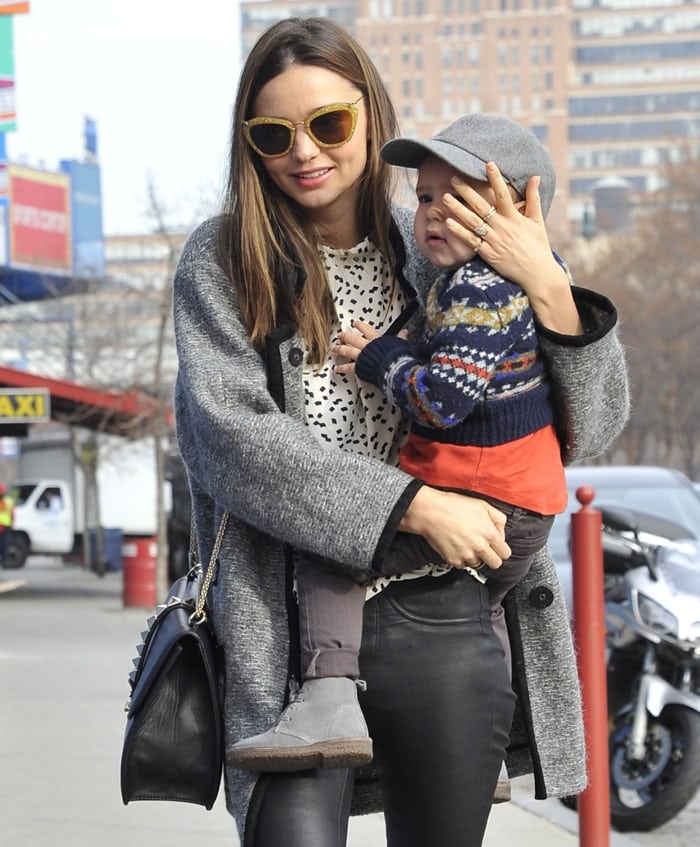 Miranda Kerr hiding her son from the paparazzi while out and about in New York City, November 29, 2012