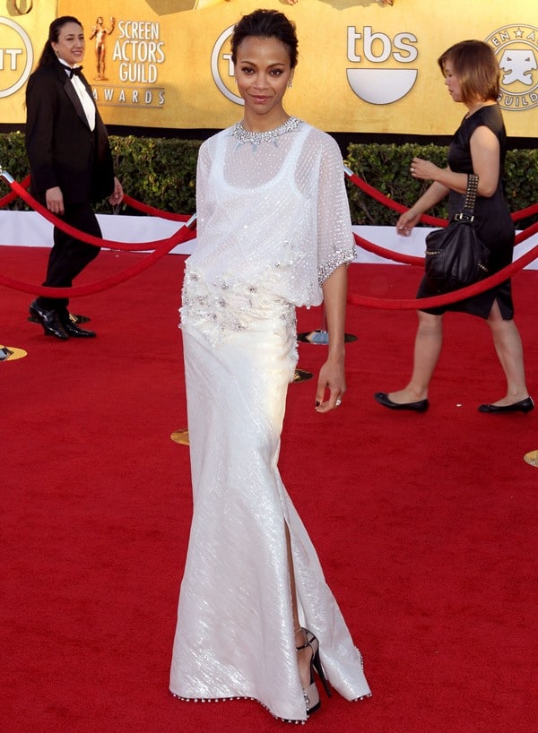 Zoe Saldaña brings modern elegance to the SAG Awards in a shimmering white Givenchy Couture gown with delicate embellishments and a soft, draped silhouette