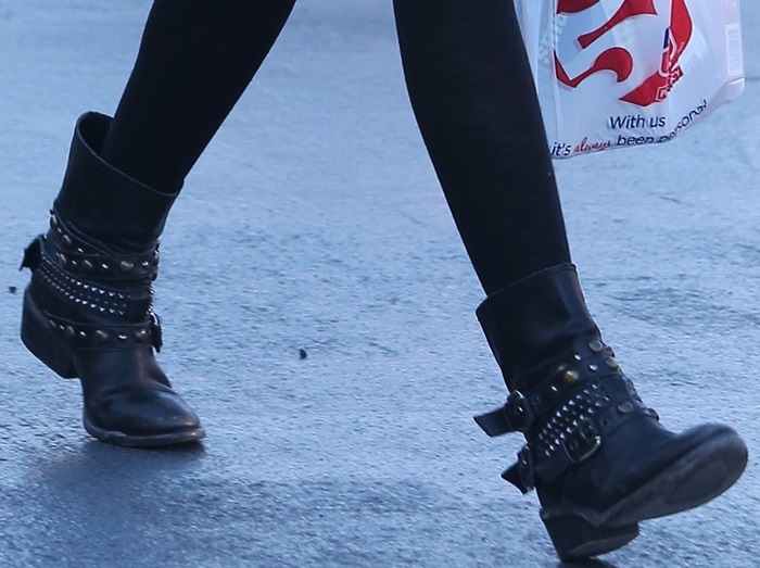Ashley Tisdale stylishly pairs her studded cowboy-inspired biker booties with a casual ensemble for an outing in Los Angeles