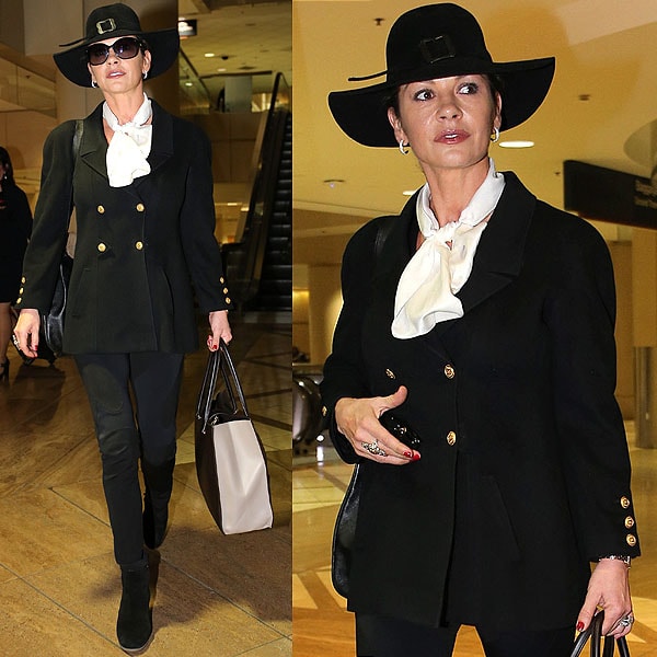 Catherine Zeta Jones is in a world of her own in this witch hat-topped ensemble