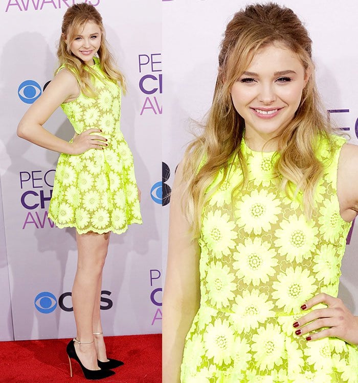 Chloë Grace Moretz stands out in a neon yellow Simone Rocha dress with a playful daisy pattern at the 39th Annual People's Choice Awards