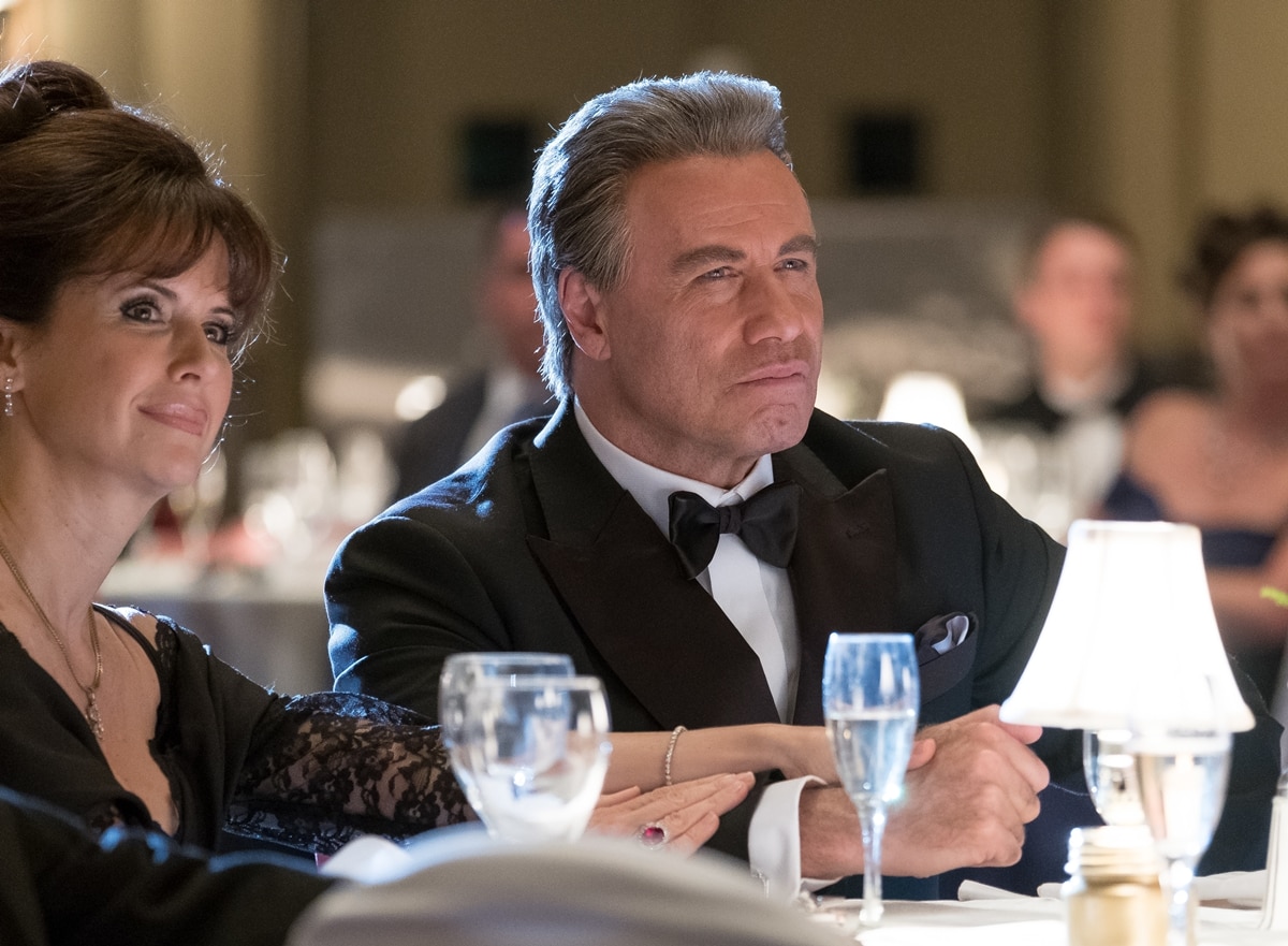 John Travolta as John Gotti and Kelly Preston as Victoria Gotti in the 2018 American biographical crime film Gotti