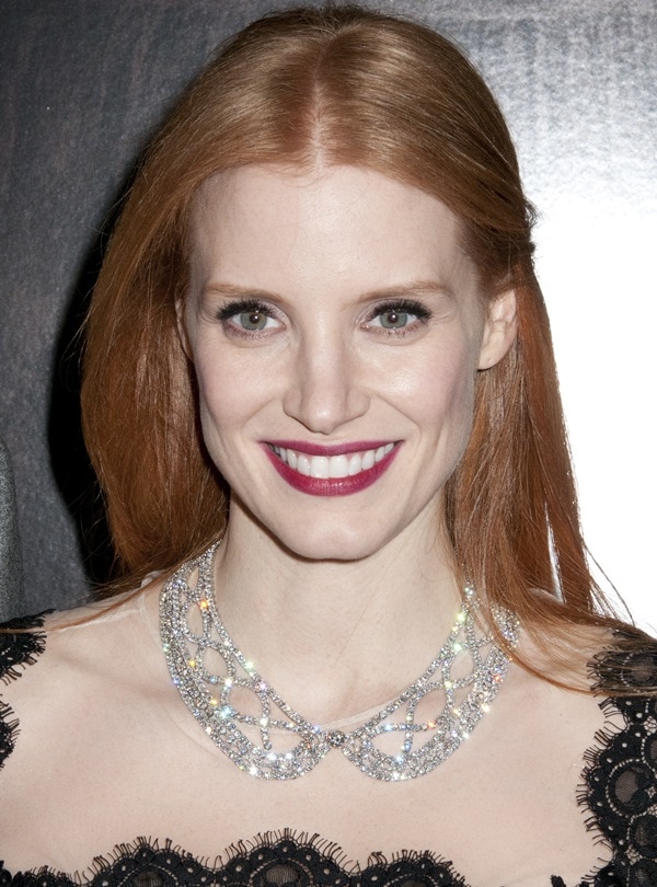 Jessica Chastain dazzled with a bold berry lip and a sparkling crystal necklace while attending the premiere of Mama