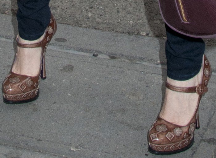 Jessica Chastain’s flower-embellished Prada Mary Jane heels feature buckled straps and sculpted flared stiletto heels that elevate her chic ensemble