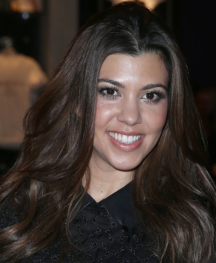 Kourtney Kardashian wears her dark hair down