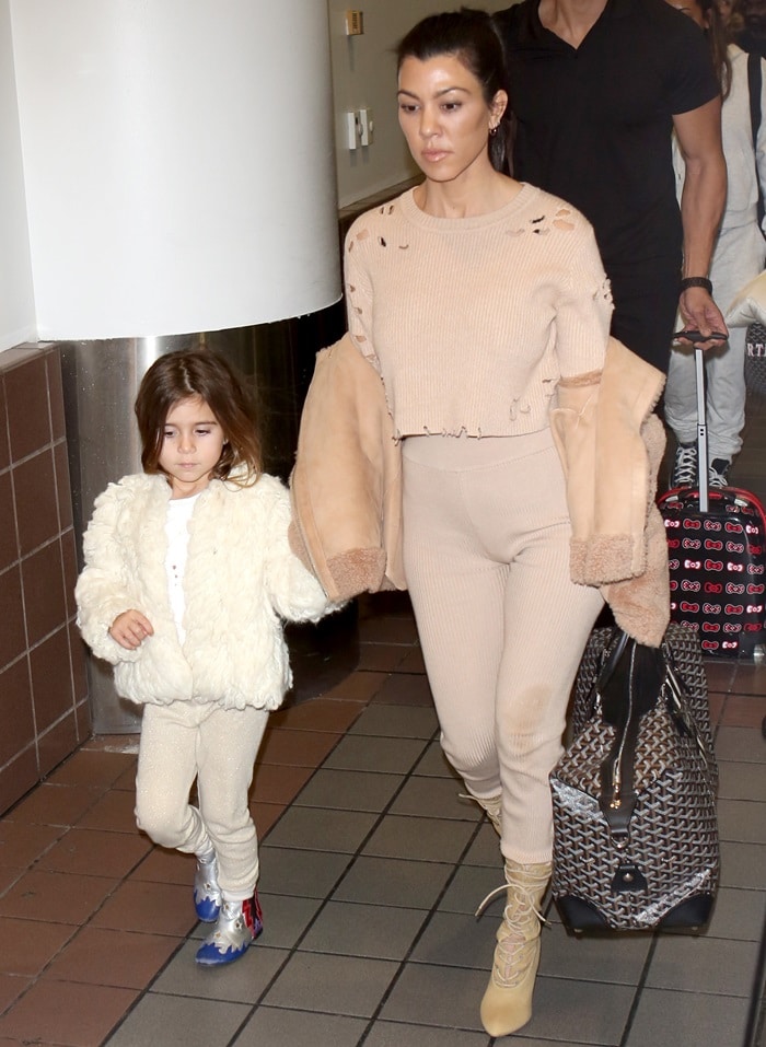 Kourtney Kardashian in a distressed White Fox 'Bronx' knit crop styled with matching 'Lenox' leggings