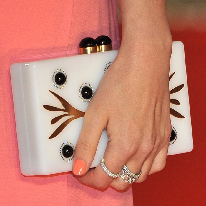 Rose Byrne toting an ivory clutch by Thale Blanc