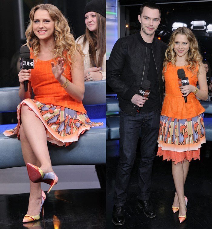 Teresa Palmer, wearing a bright orange Harlyn peplum top, a printed Etro skirt, and colorful Christian Louboutin Pigalle Pollock pumps, appears with co-star Nicholas Hoult on Much Music's New.Music.Live. television show