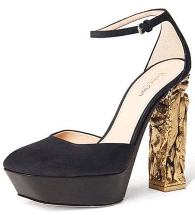 Calvin Klein’s Spring 2013 platform pump features a sleek black upper balanced by a striking, artfully carved metallic heel