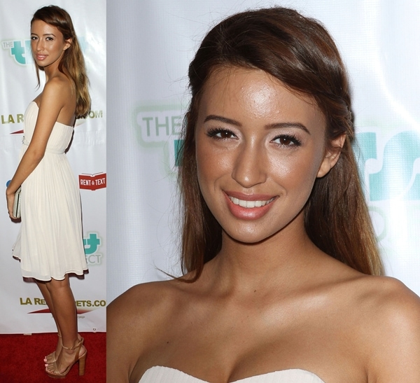 Christian Serratos in a white strapless dress and neutral platform ankle-strap sandals at the Thirst Gala
