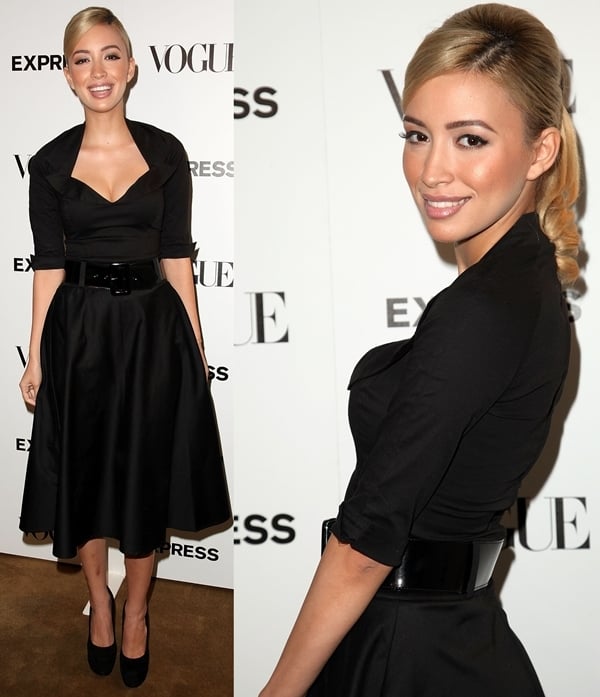 Christian Serratos in a black midi dress and black suede platform pumps at the Vogue Scenemakers celebration