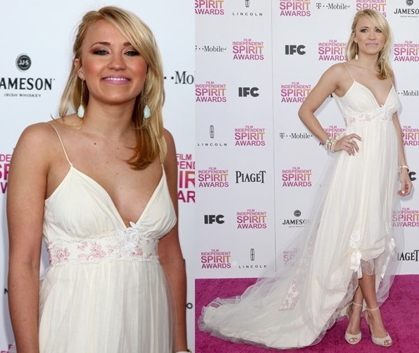Emily Osment looks ethereal in a flowing white gown with delicate lace details, paired with matching heels and statement earrings