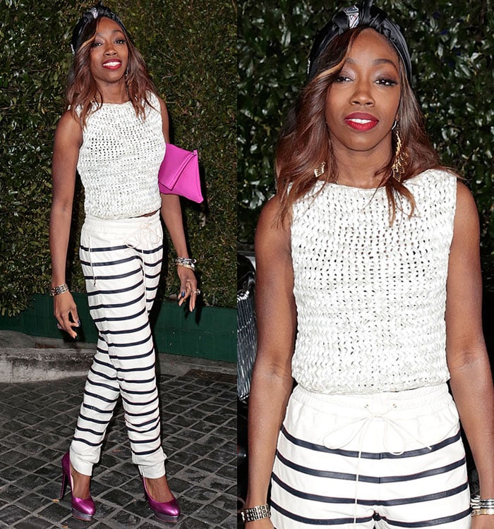 Estelle exudes bold style at the Topshop Topman LA opening, pairing fuchsia metallic Charlotte Olympia pumps with chic striped pants and a textured sleeveless top