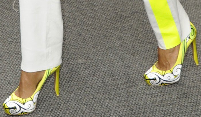 A closer look at Jada’s statement Nicholas Kirkwood heels reveals a striking graffiti-inspired neon print, sculptural curved heel, and dramatic platform silhouette