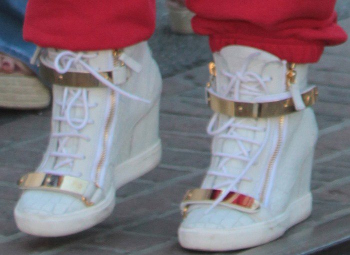 Jennifer Lopez rocks gold Giuseppe Zanotti sneakers