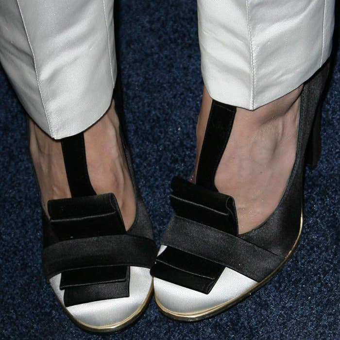 From the front, the shoes reveal their distinctive hybrid design—mixing loafer-inspired structure with a feminine pump silhouette and graphic monochrome finish