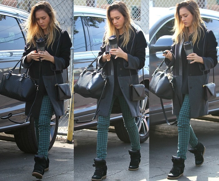 Jessica Alba keeps it effortlessly casual-chic in Big Star Alex printed houndstooth skinny jeans, a Gerard Darel coat and Plum Perforé Riviera bag, and black Isabel Marant Bekett wedge sneakers