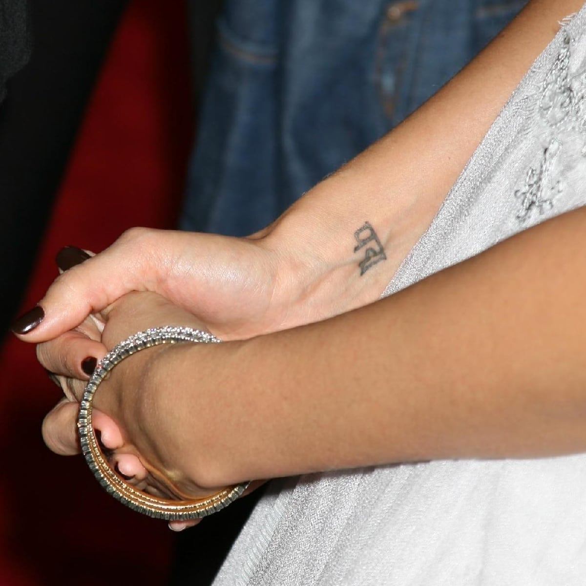 Jessica Alba’s delicate Sanskrit “Padma” tattoo on her right wrist translates to “lotus flower,” a symbol of purity and spiritual growth