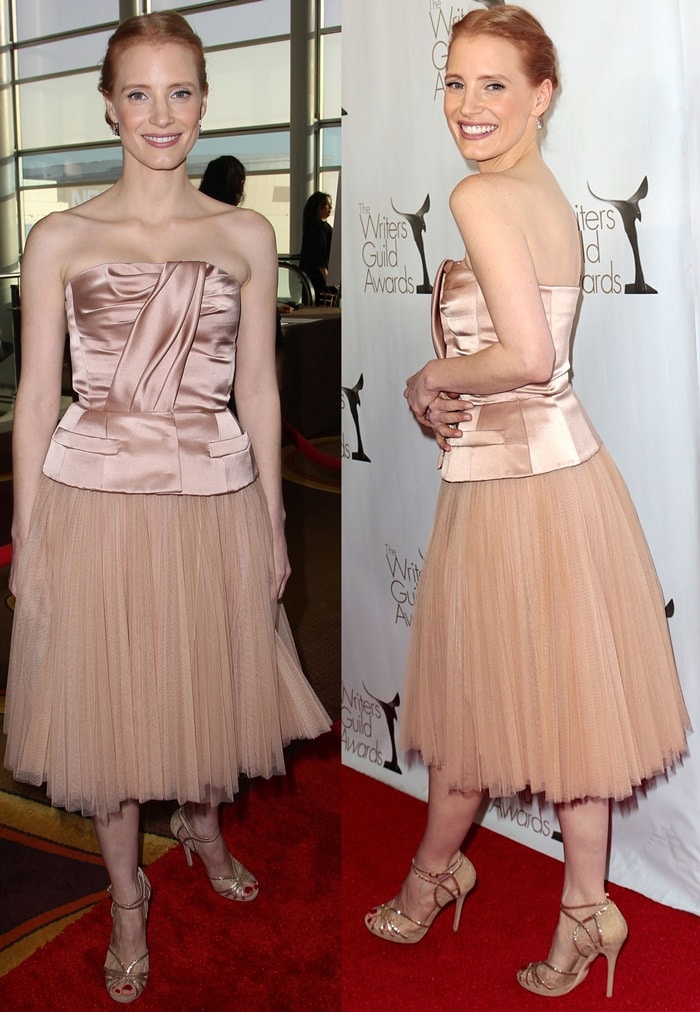 The actress poses on the red carpet, revealing the architectural corset-style bodice and airy tulle skirt that define the look’s refined, ballet-inspired silhouette