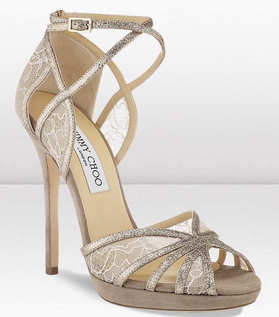 The Jimmy Choo Fayme sandals feature lace panels layered with metallic straps, combining romance and structure in a sky-high platform design