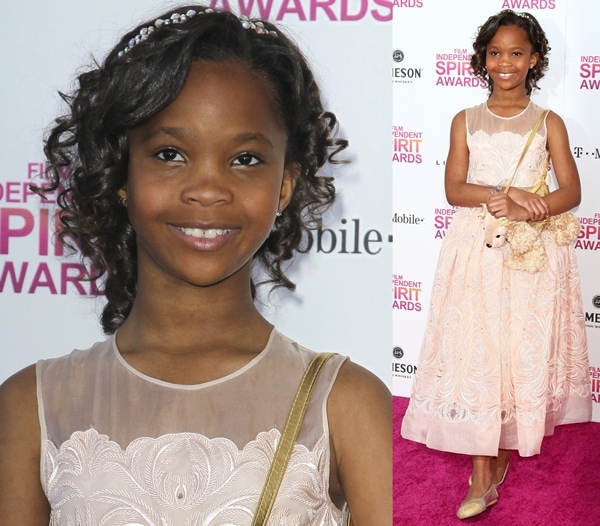 Quvenzhané Wallis looks adorable in a pink floral dress paired with cute flats and a teddy bear purse