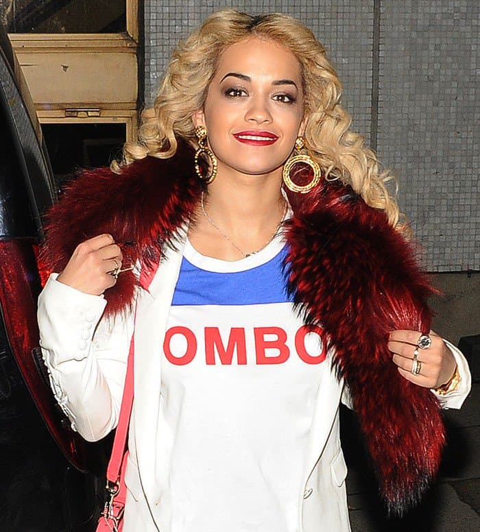 Rita Ora wearing a deep red scarf while leaving the London studios after taping her appearance on the "Graham Norton Show"