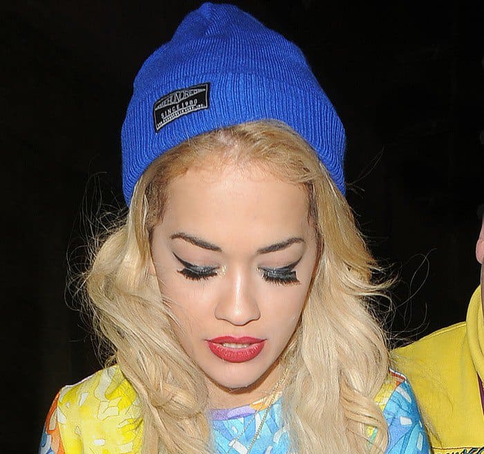 Rita Ora exudes urban chic with a blue beanie complementing her House of Holland dress, showcasing her unique b-girl flair