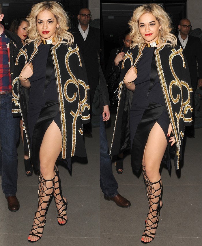 Rita Ora stuns outside a London hotel on February 16, 2013, in an embellished Moschino coat, a daring slit dress, and striking Jimmy Choo gladiator sandals