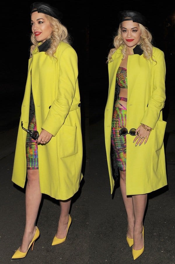 Rita Ora perfectly balances playful energy with high-end glamour, styling her vibrant cut-out trousers and bright yellow coat with the iconic Christian Louboutin Batignolles pumps