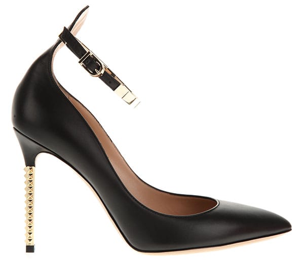 Valentino Studded Resort 2013 Pumps — Crafted in black calf leather, the pointed-toe pumps are finished with a low-dipped vamp, delicate ankle straps, and a slim stiletto heel accented with signature gold-tone pyramid studs