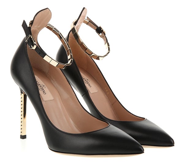 Valentino Studded Resort 2013 Pumps — Crafted in black calf leather, the pointed-toe pumps are finished with a low-dipped vamp, delicate ankle straps, and a slim stiletto heel accented with signature gold-tone pyramid studs