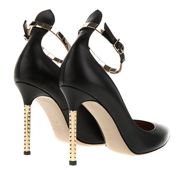 Valentino Studded Resort 2013 Pumps — Crafted in black calf leather, the pointed-toe pumps are finished with a low-dipped vamp, delicate ankle straps, and a slim stiletto heel accented with signature gold-tone pyramid studs