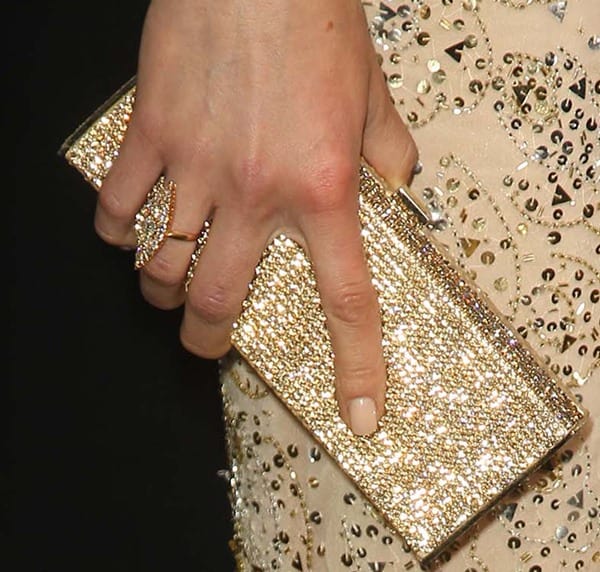Adrianne carried a Daniel Swarovski gold crystal ‘Lana’ box clutch
