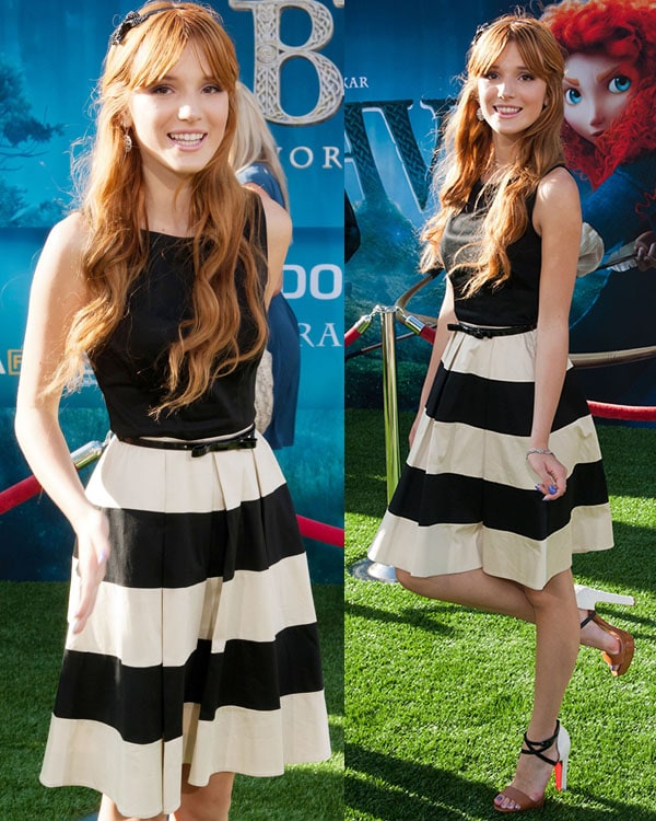 Bella Thorne looks effortlessly stylish in a black and cream striped dress paired with bold heels at the Brave movie premiere
